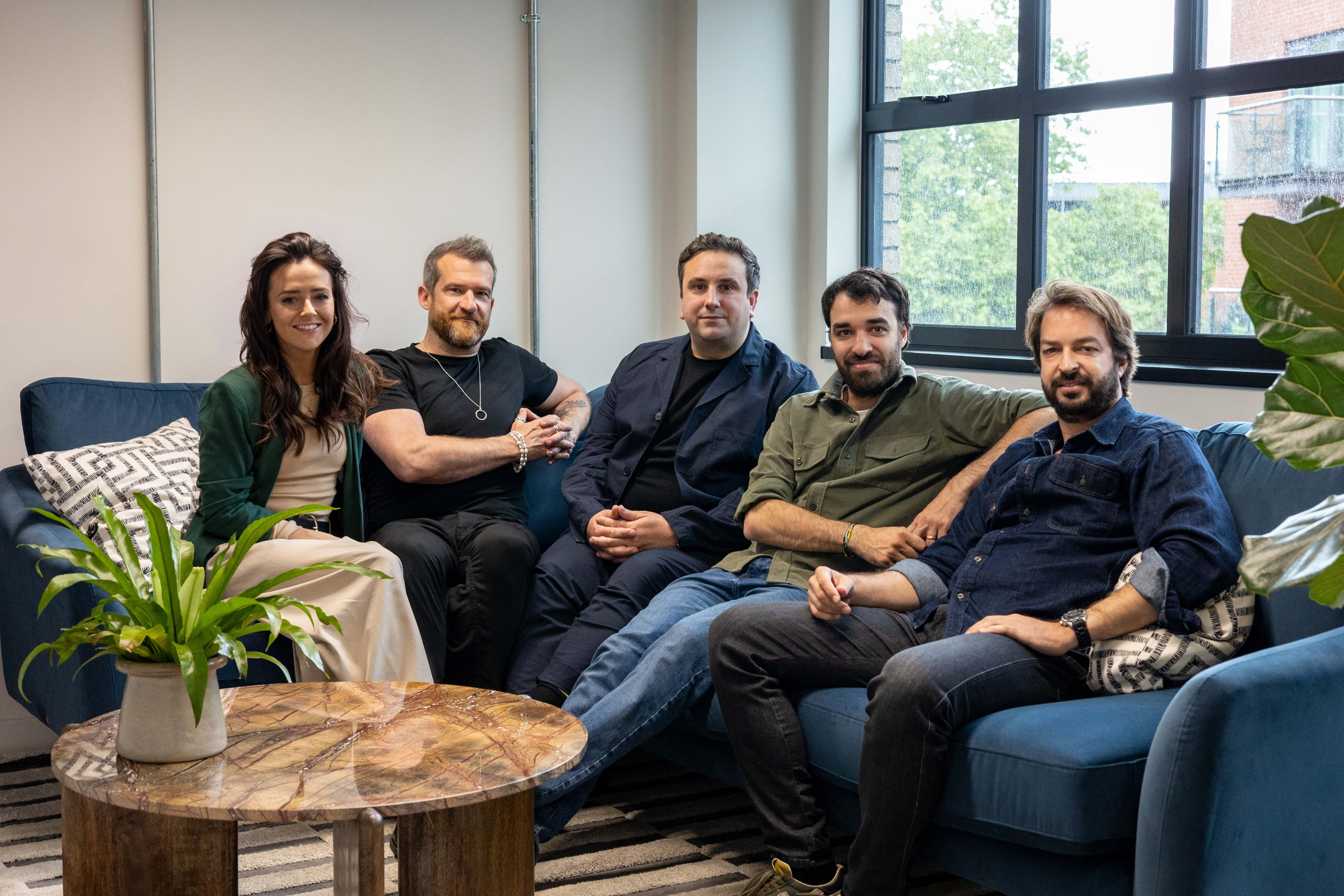 The GOA team together on a sofa in the office